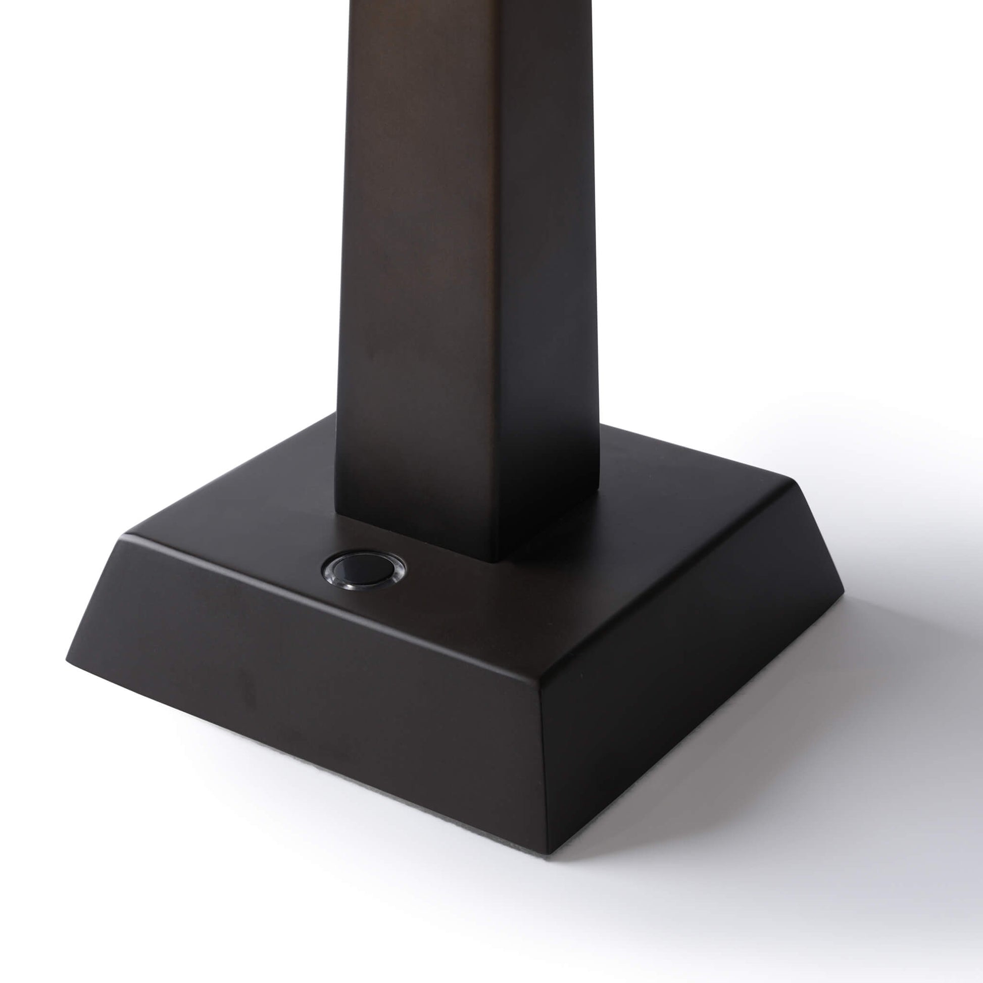 Square base of the metallic table lamp featuring a sleek touch control button.