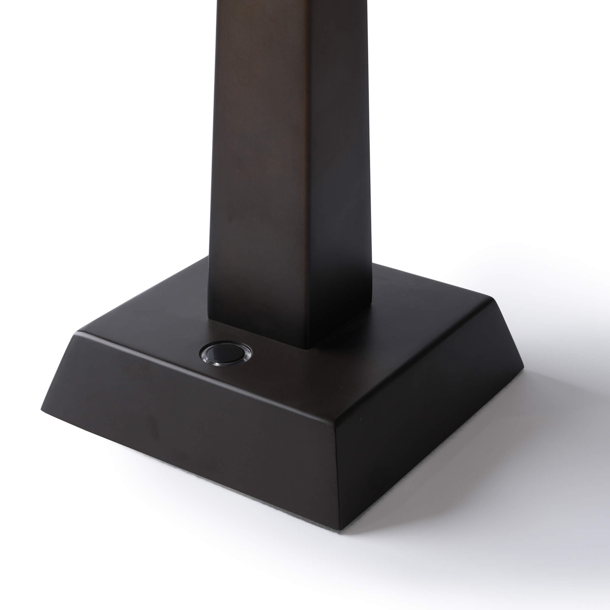 Square base of the metallic table lamp featuring a sleek touch control button.