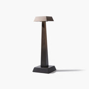 Full view of the ARTAMORE brushed stainless steel table lamp showing its minimalist sculptural silhouette.