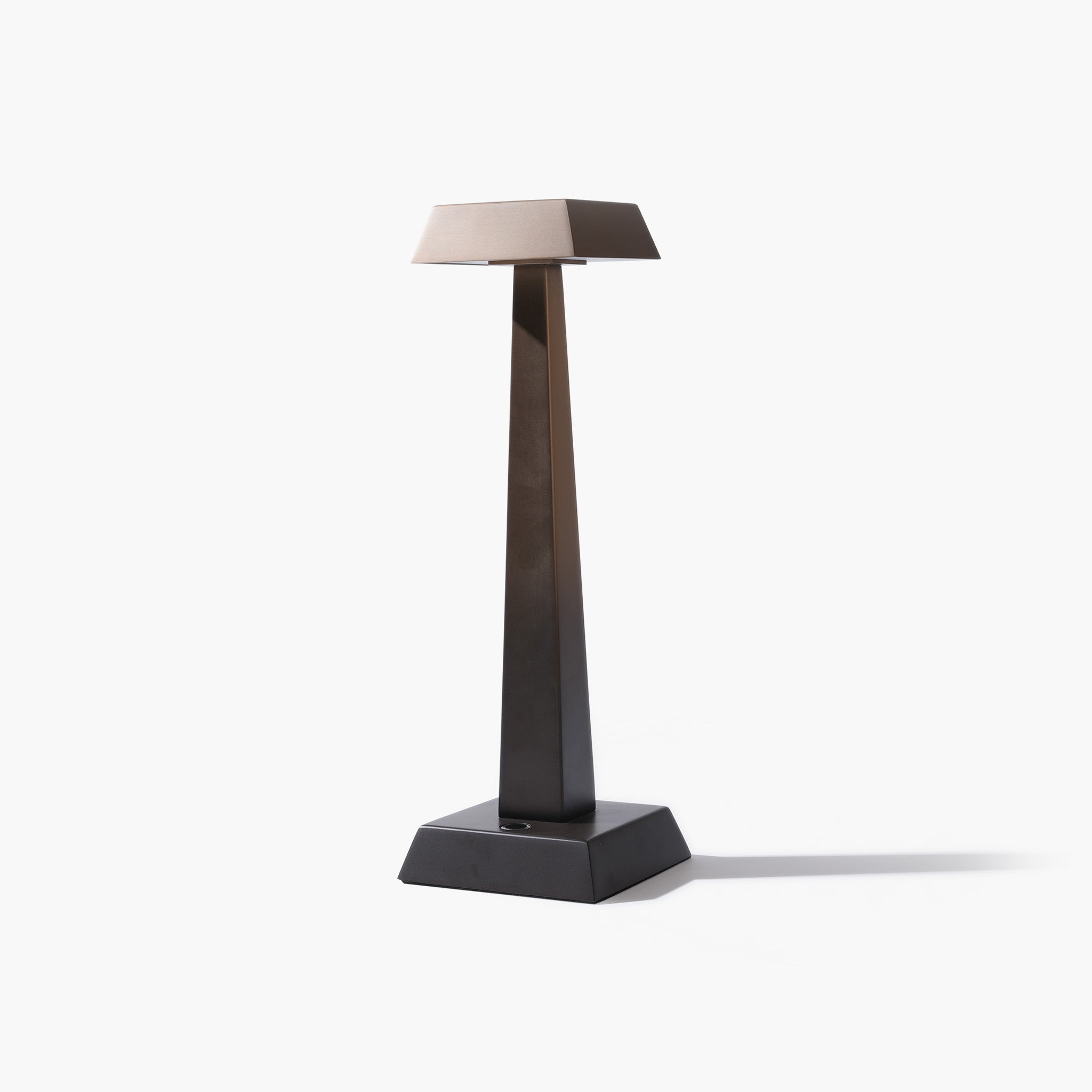 Full view of the ARTAMORE brushed stainless steel table lamp showing its minimalist sculptural silhouette.