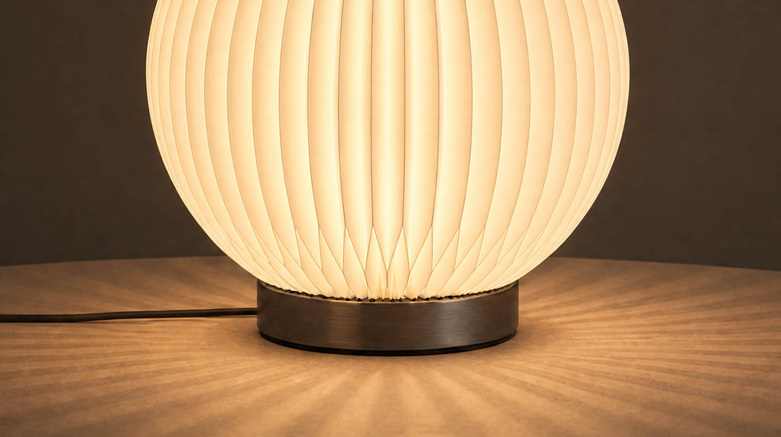 The artamore minimalist bedside lamp placed in a quiet modern bedroom, featuring three adjustable lighting modes for versatile daily moods.