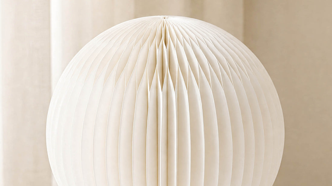 Detailed shot of the artamore pleated paper lamp, showcasing the high-quality FSC-certified paper material and its exquisite honeycomb texture.
