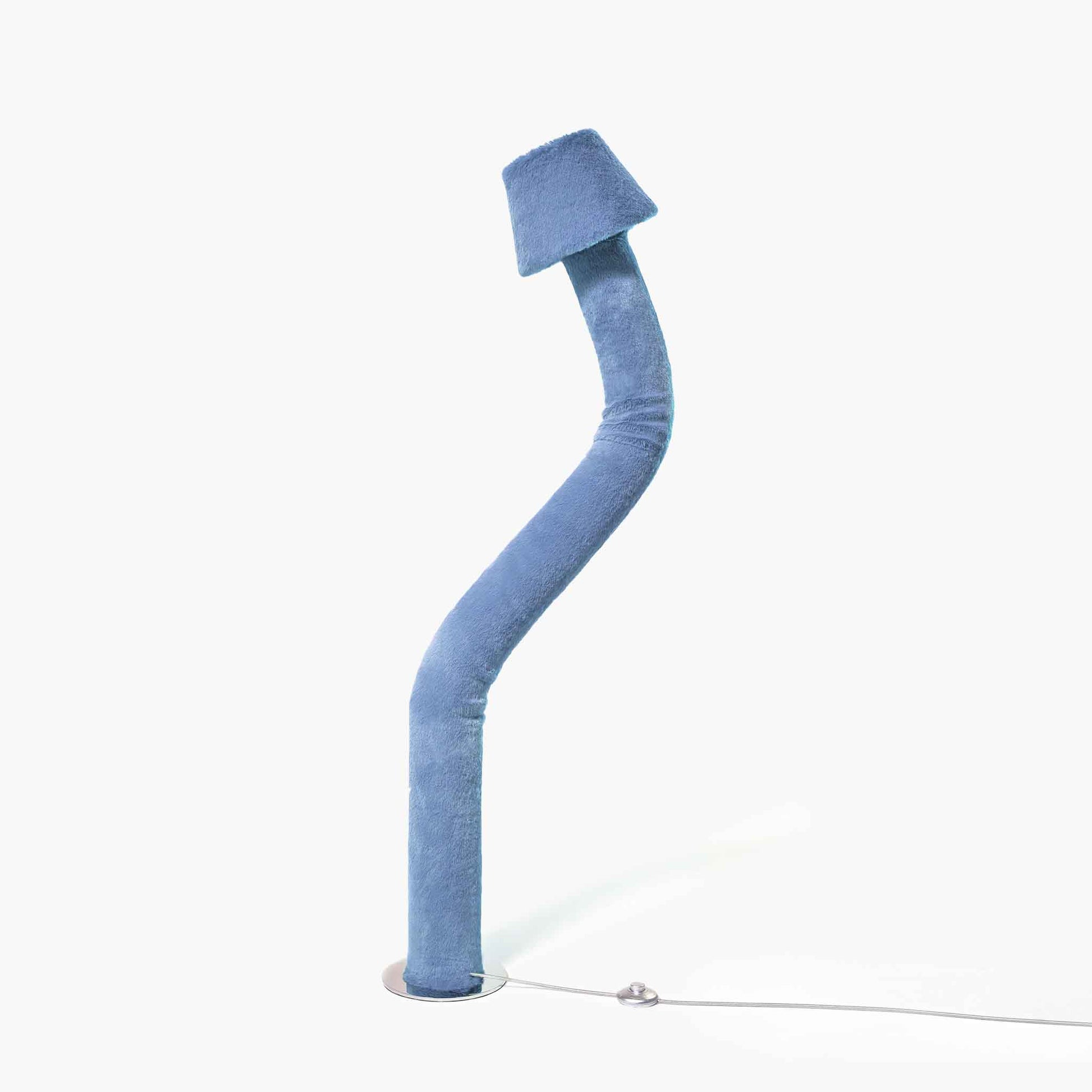 Modern blue eco-friendly faux fur standing lamp casting a soft ambient glow for elegant home spaces.