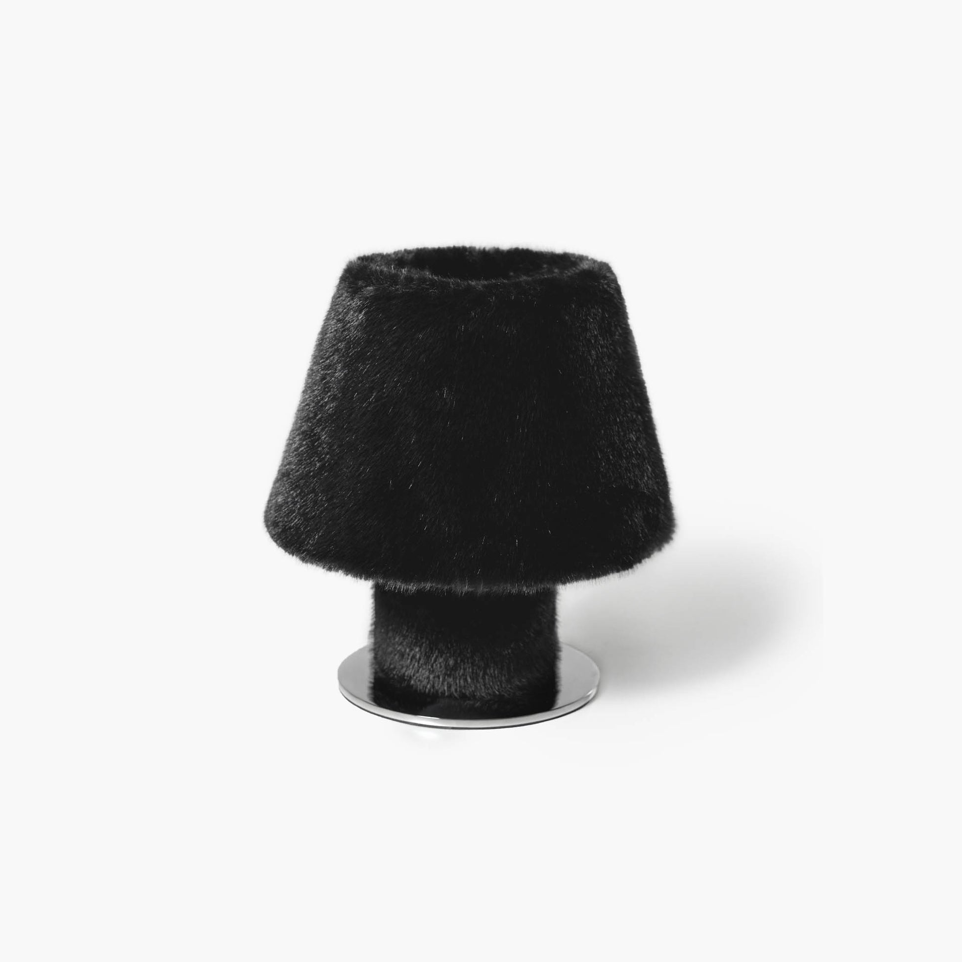 Sophisticated black minimalist faux fur nightstand lamp anchoring a serene, quiet luxury bedroom setup.