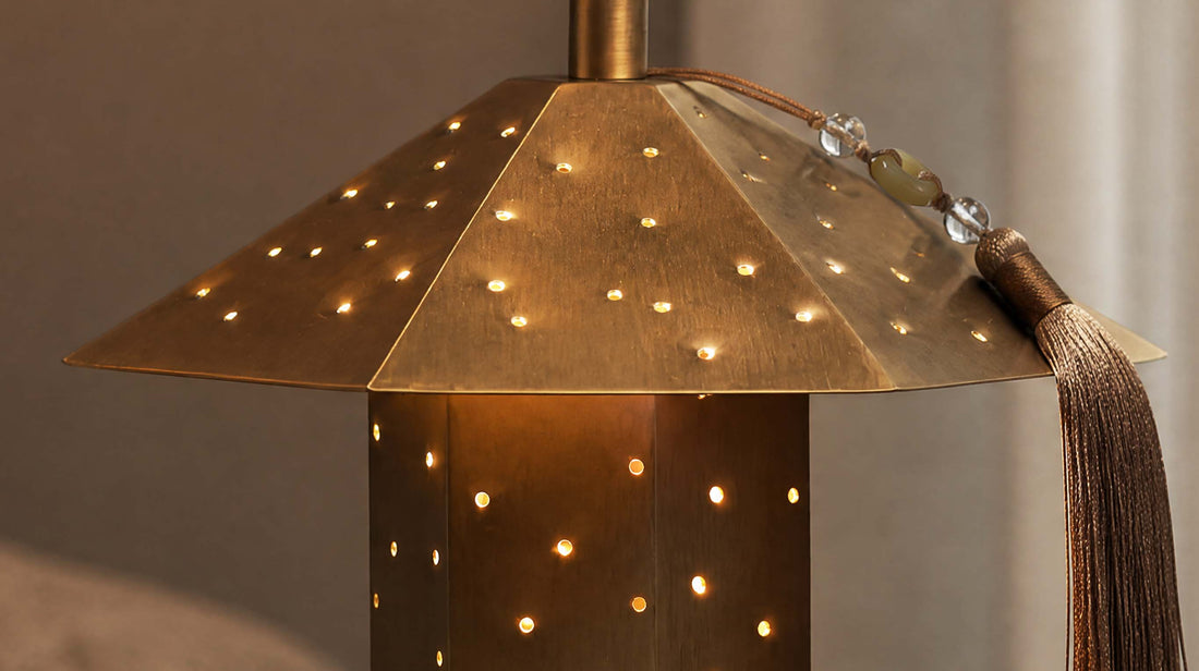 Detailed view of the artamore polyhedron table lamp emitting a dreamy starry light transmission effect through carefully designed hammered openings.
