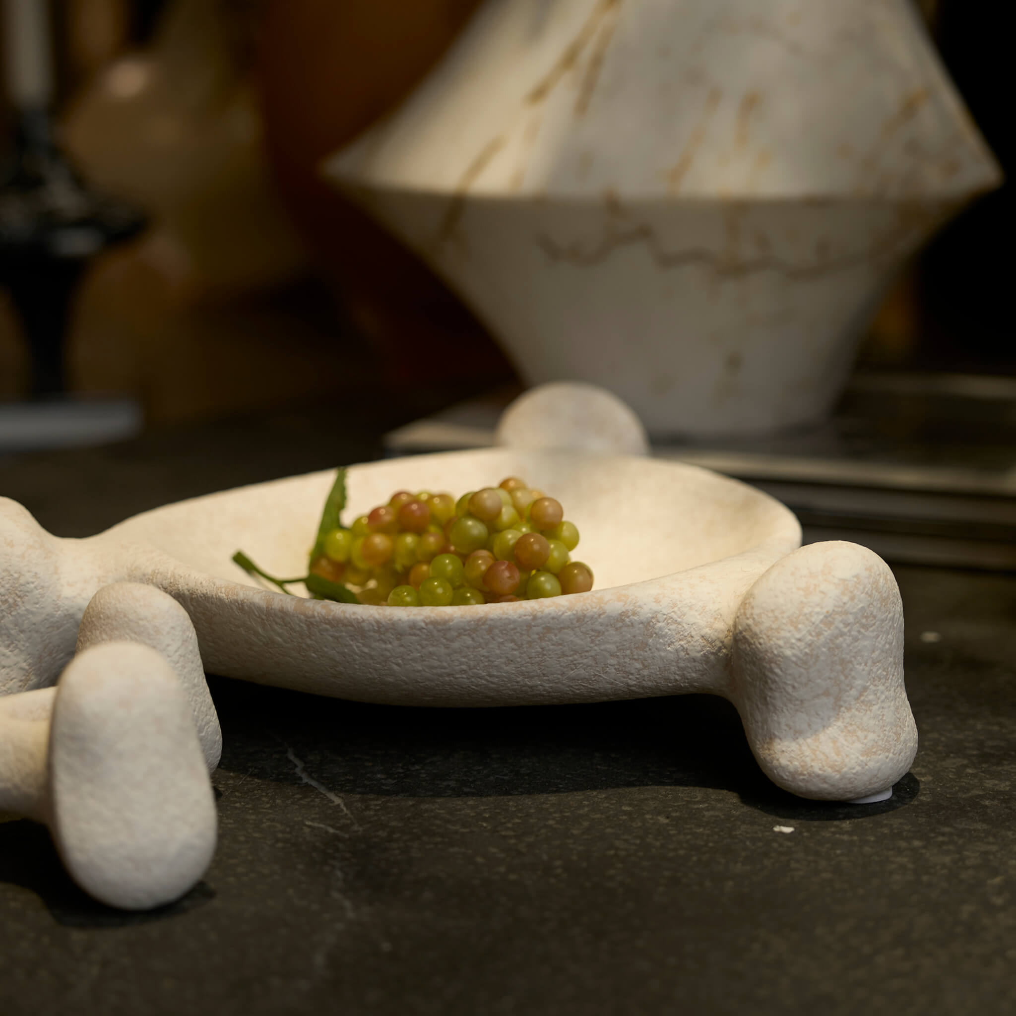 Reef ceramic tray and candle holder used as an elegant and tactile table centerpiece