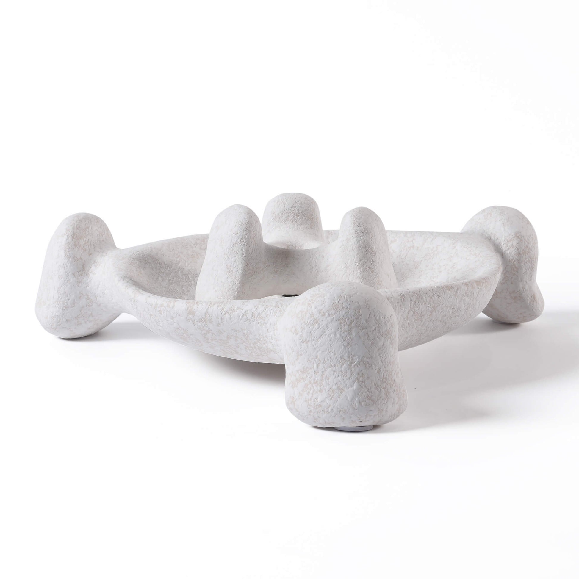 Natural beige ceramic tray with an organic sculptural shape and textured finish
