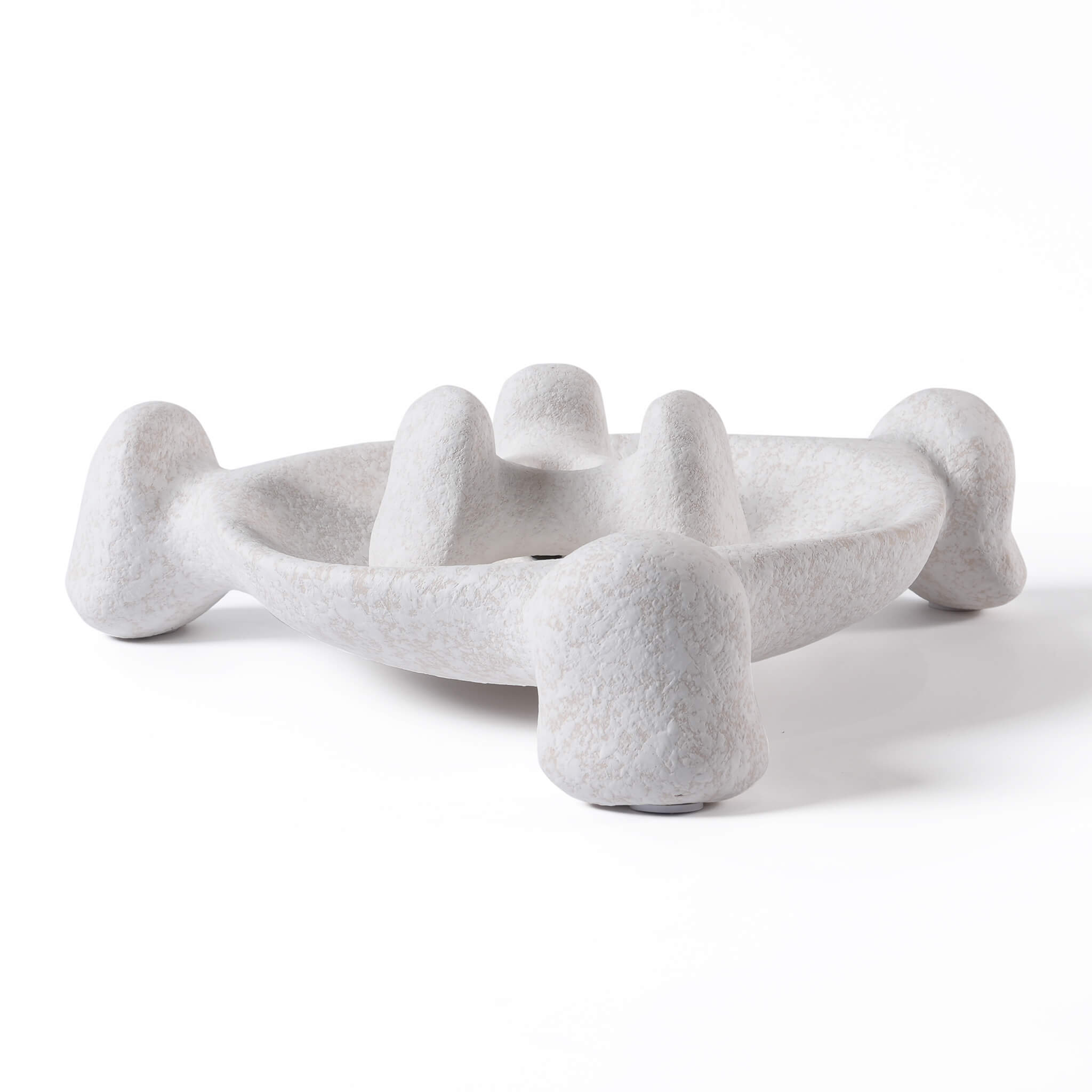 Natural beige ceramic tray with an organic sculptural shape and textured finish