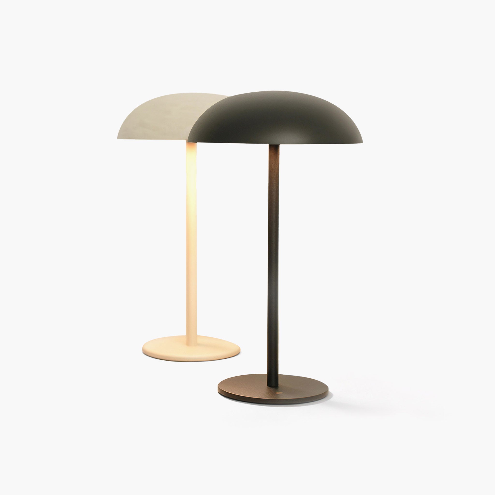 cordless high CRI desk lamp illuminating a minimalist modern workspace with museum-quality light.