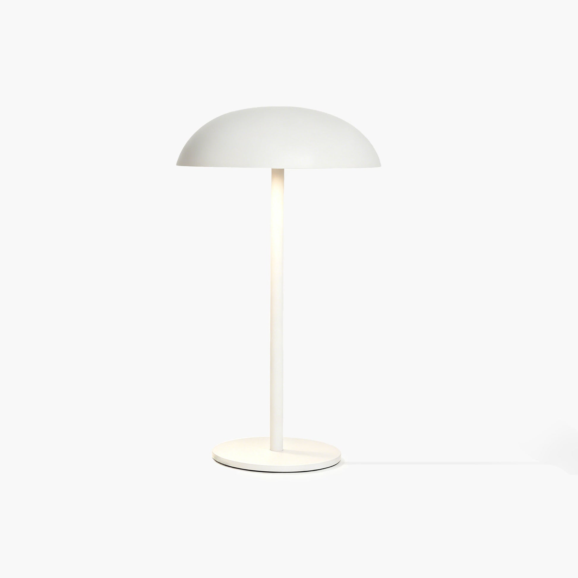 White Relax-W desk lamp with micro-cement base and DIY painting tools for unique artistic curation.