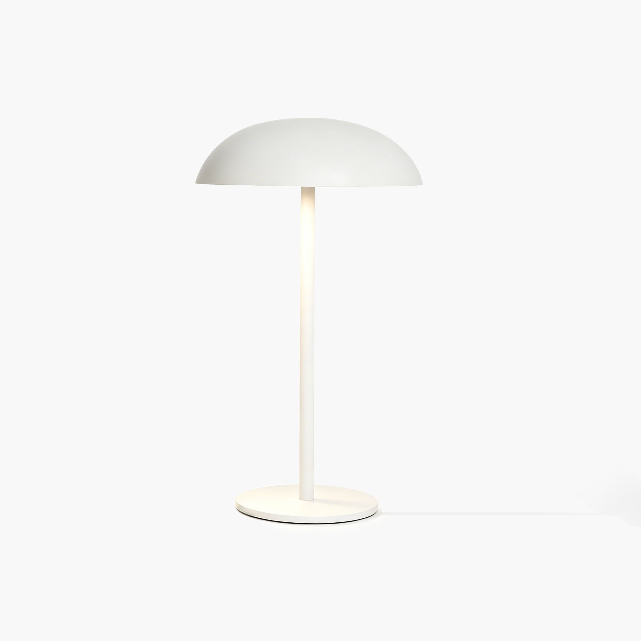 White Relax-W desk lamp with micro-cement base and DIY painting tools for unique artistic curation.