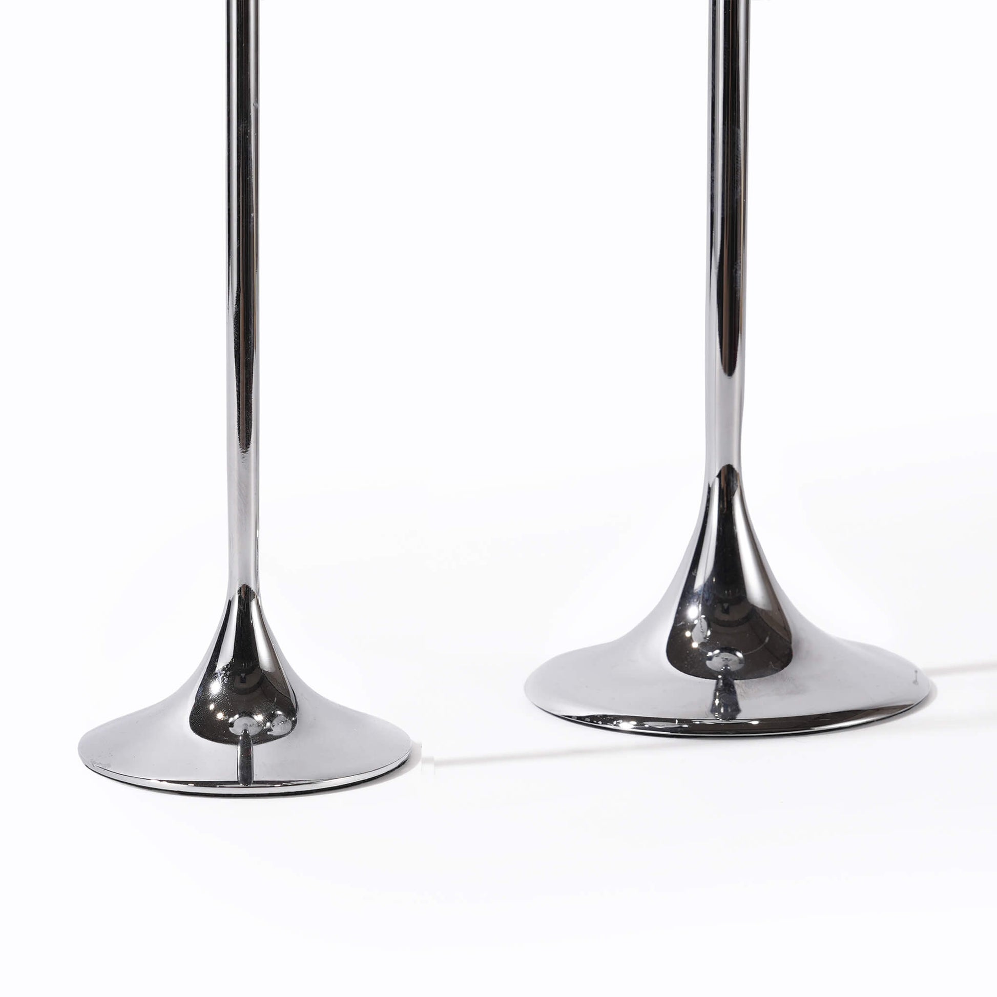 Close-up of the premium weighted metal bases on the silver candlestick, designed for a substantial and high-end feel