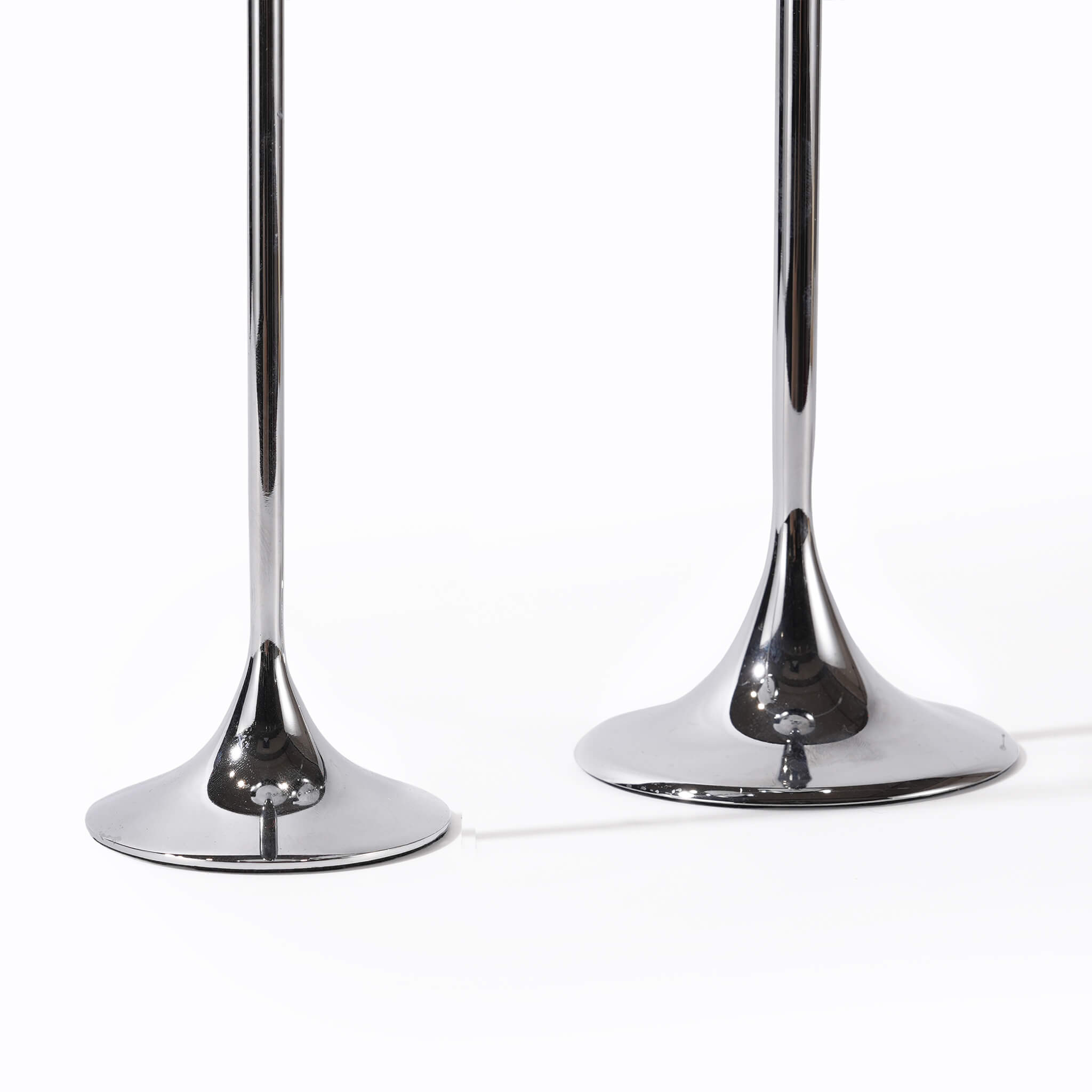 Close-up of the premium weighted metal bases on the silver candlestick, designed for a substantial and high-end feel