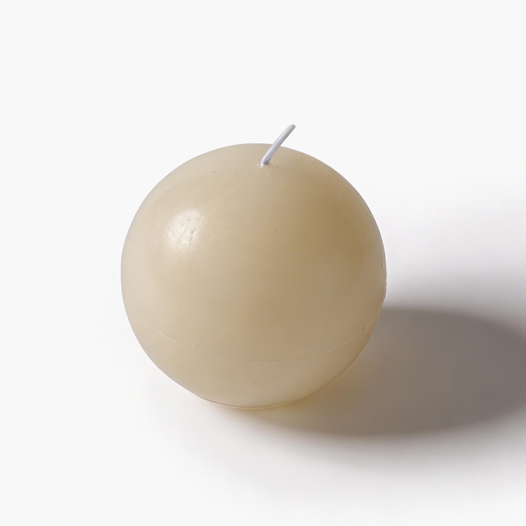 Minimalist white sculptural knot decor resting on dark wood, an essential piece for quiet luxury styling.