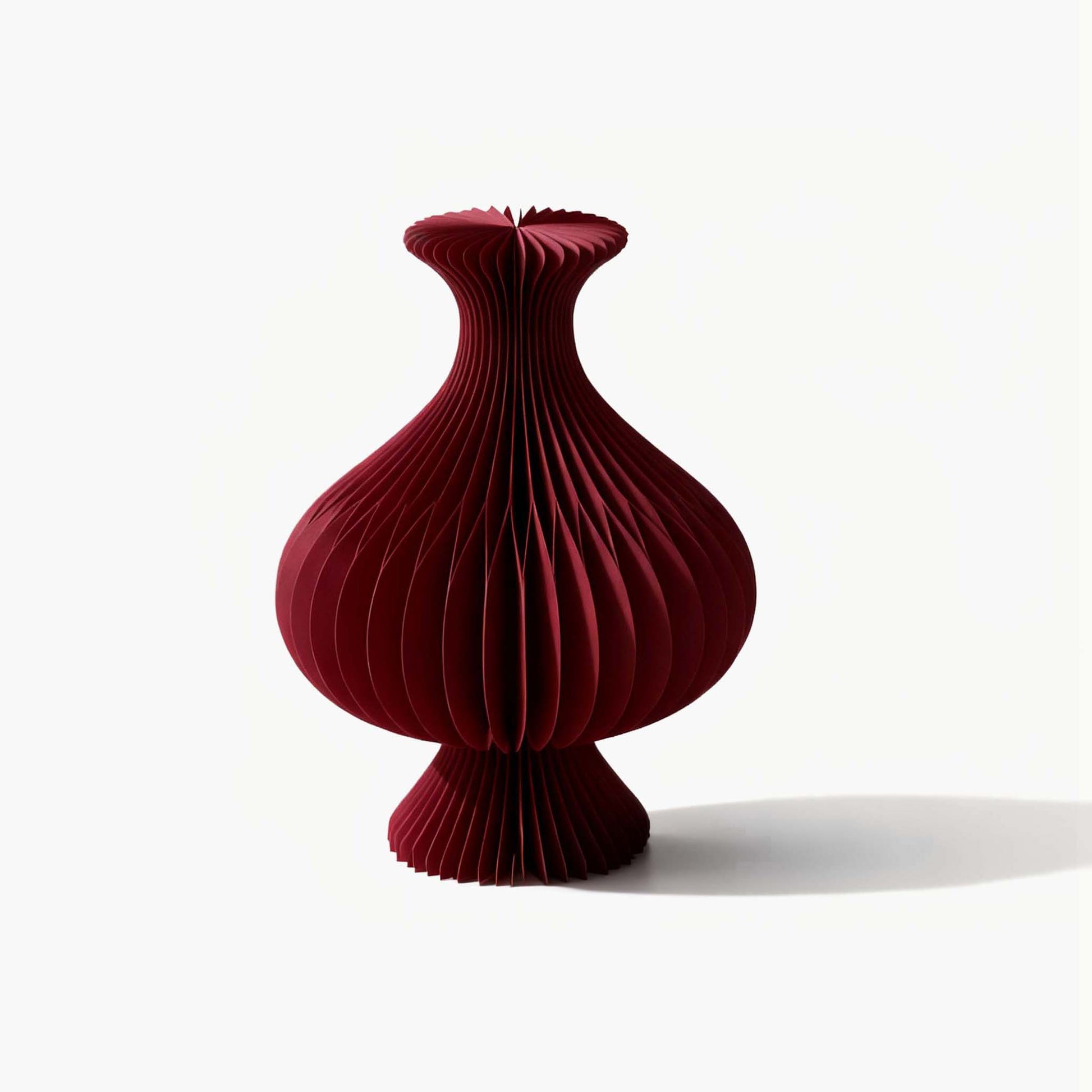 Artistic red eco-friendly small tabletop vase, adding a refined touch to your warm and essential minimalist living room.