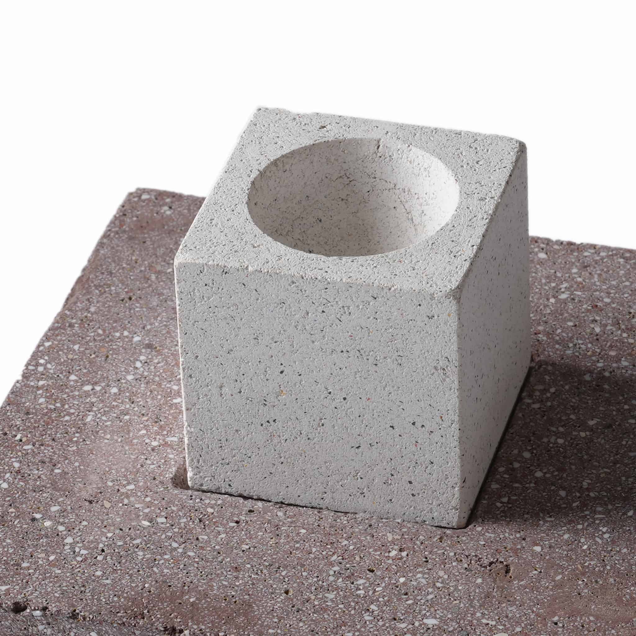 Close-up of the natural porosity on the white recycled ceramic cube, which provides superior essential oil absorption