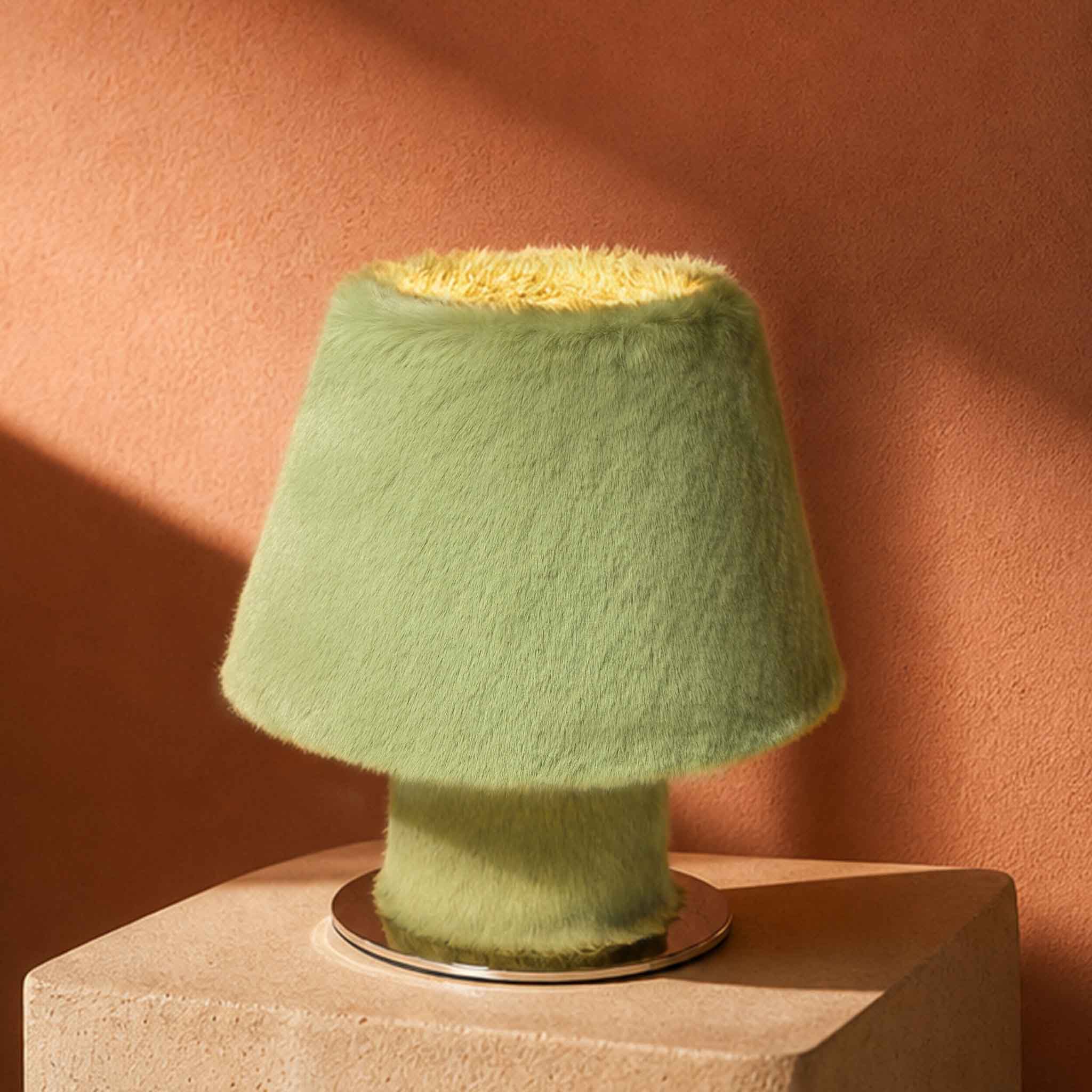Sculptural green faux fur bedside lamp with an organic modern aesthetic