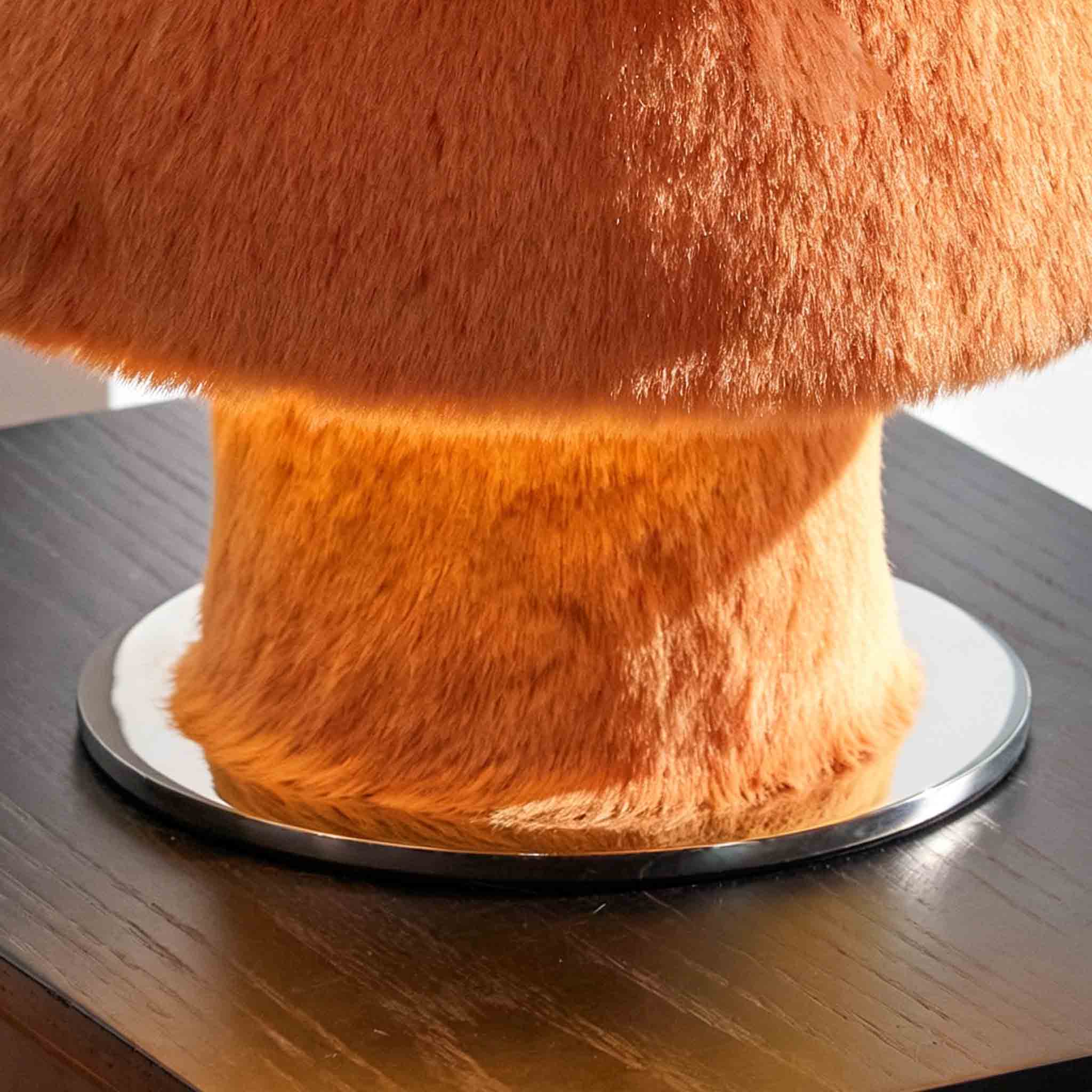 Detail of the plush base and soft light diffusing from the lamp