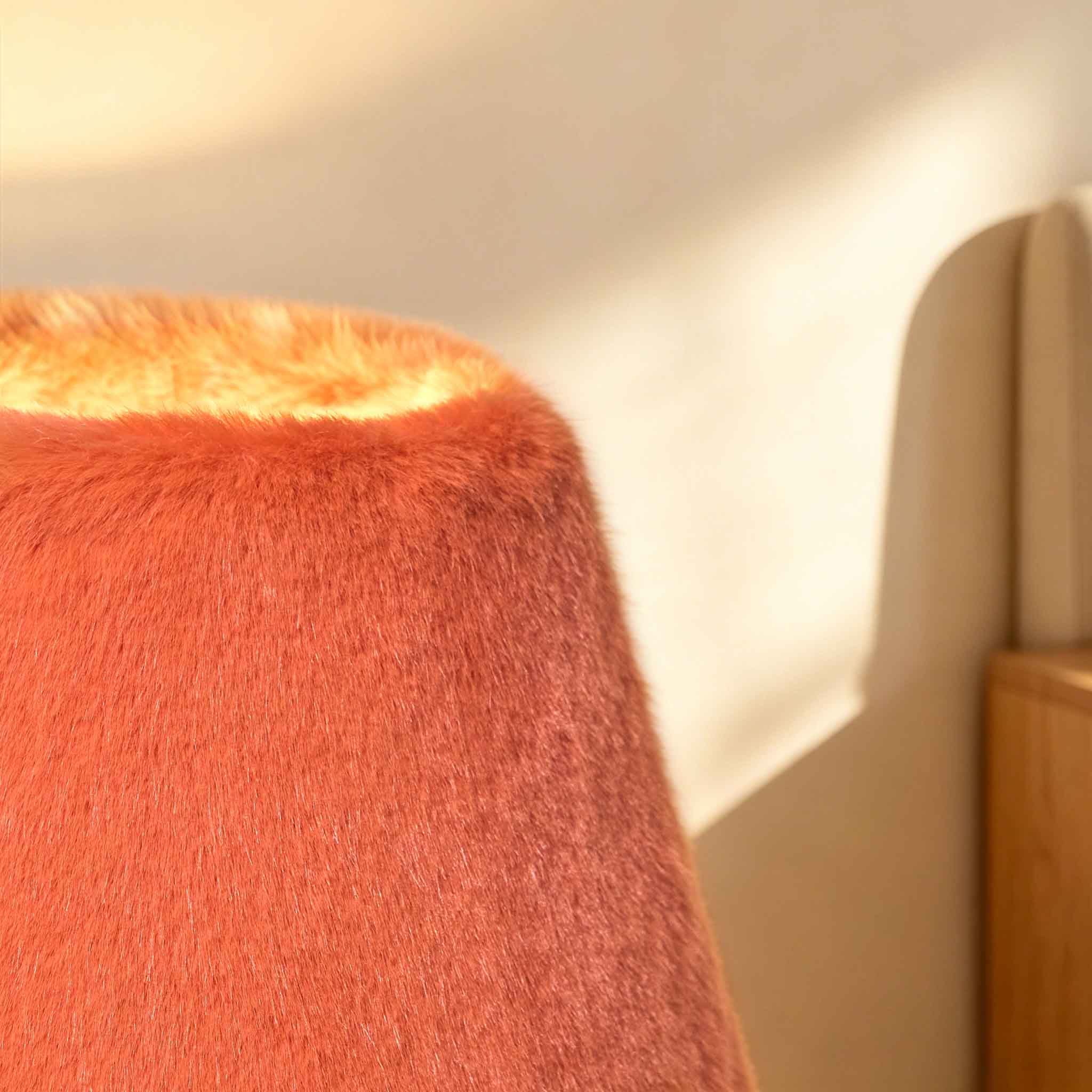 Tactile faux fur material glowing under warm modern illumination