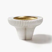 Minimalist white tall accordion paper pedestal tray with matte metal dish for modern desktop styling.