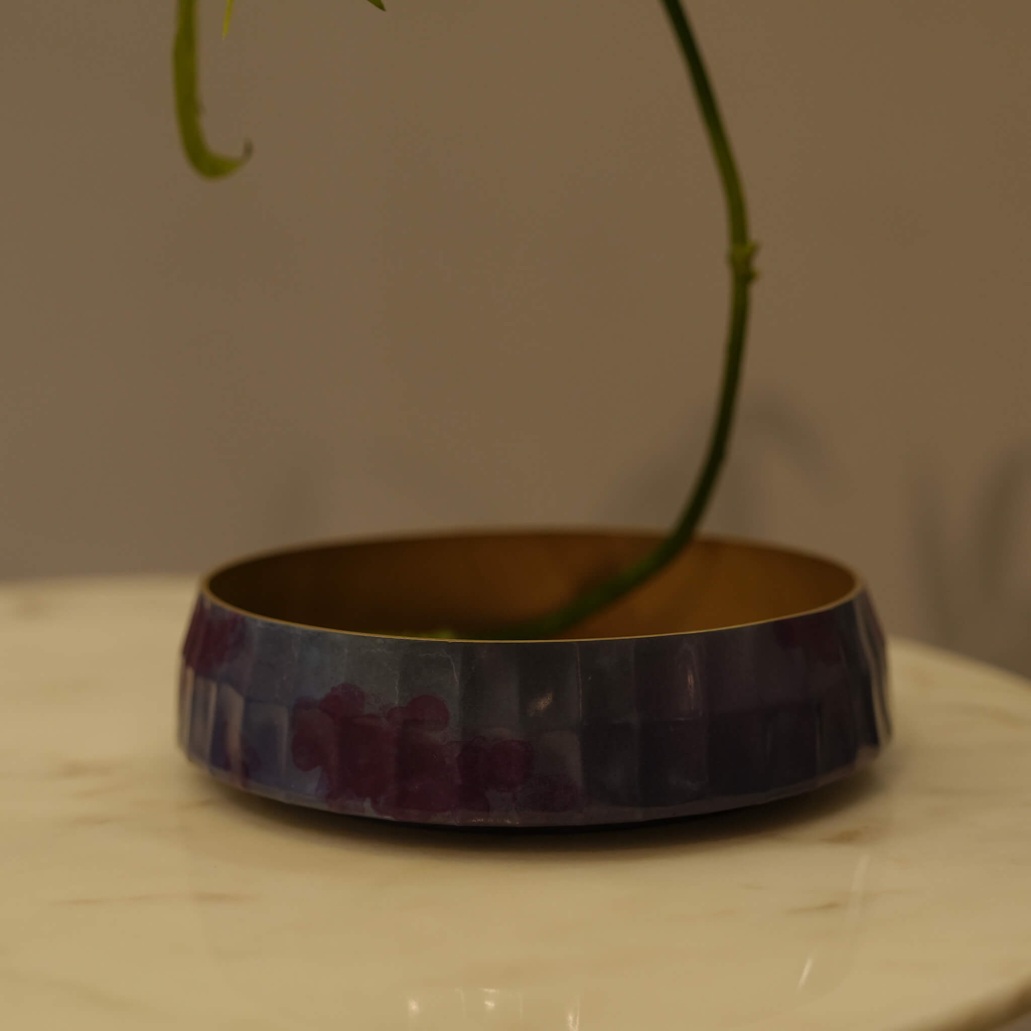 Detail of a modern floral arrangement in the solid brass Zen vessel, illustrating the fusion of natural elements and avant-garde craftsmanship
