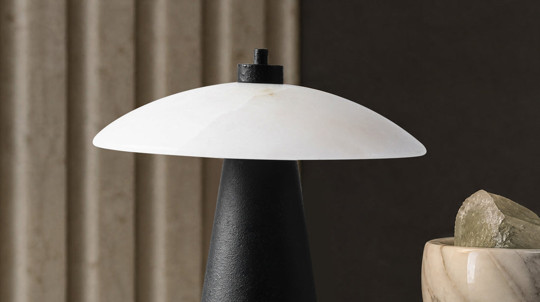 Side profile of the artamore wabi-sabi ambient lamp, revealing its minimalist geometric form and the visual contrast between natural stone and industrial metal.