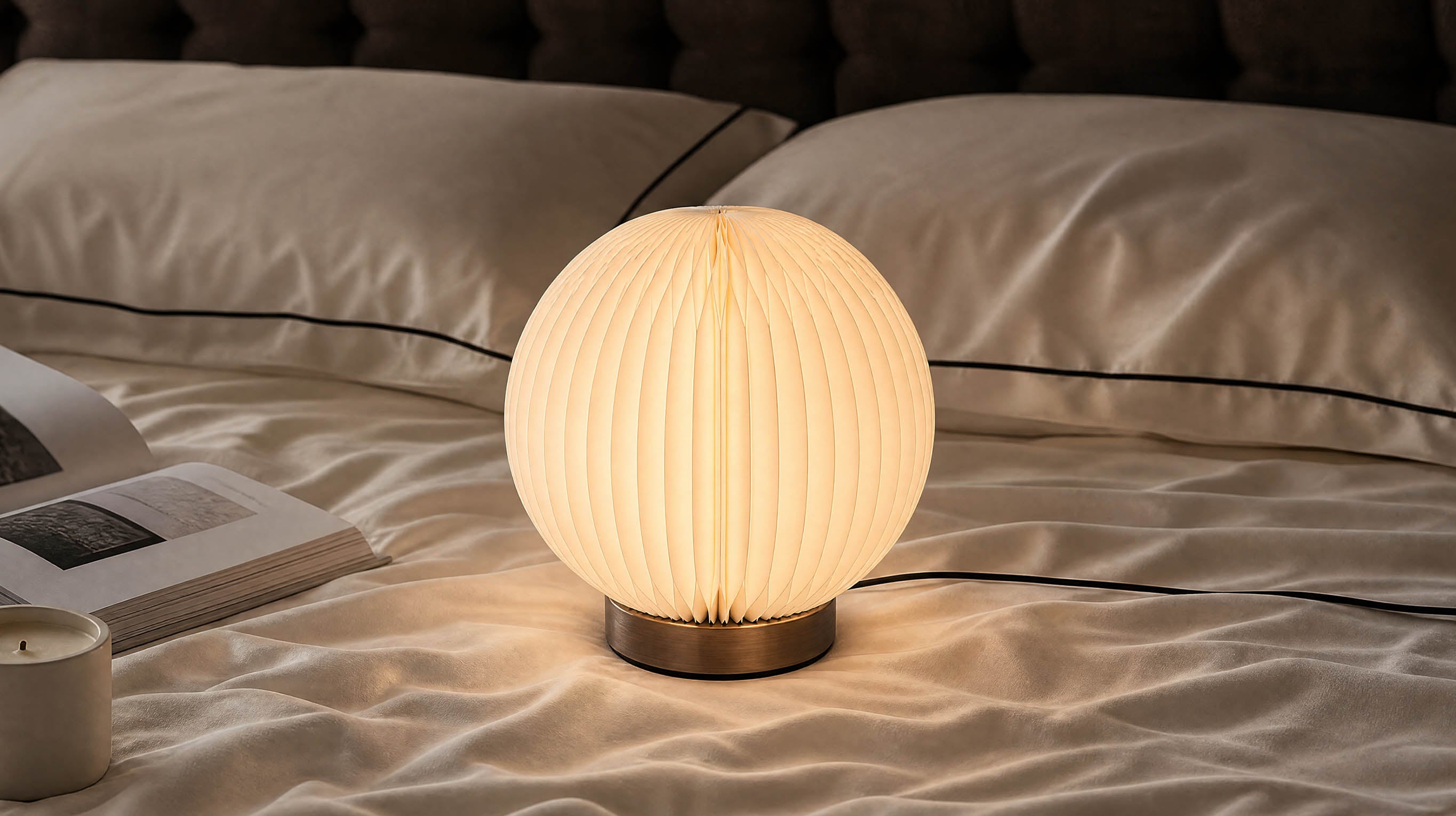 A serene lifestyle view of the artamore wabi-sabi table lamp providing soft, diffused LED lighting to create a cozy and romantic atmosphere.