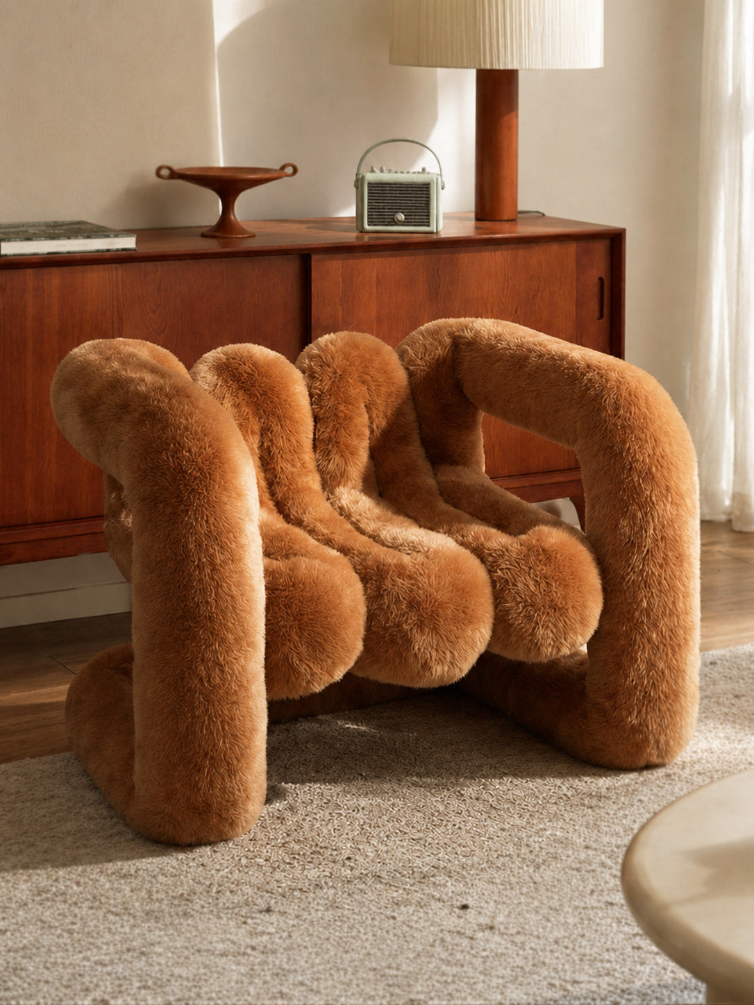 X-ZOO sculptural furry accent chair in orange and brown tones for modern living room decor by Artamore.