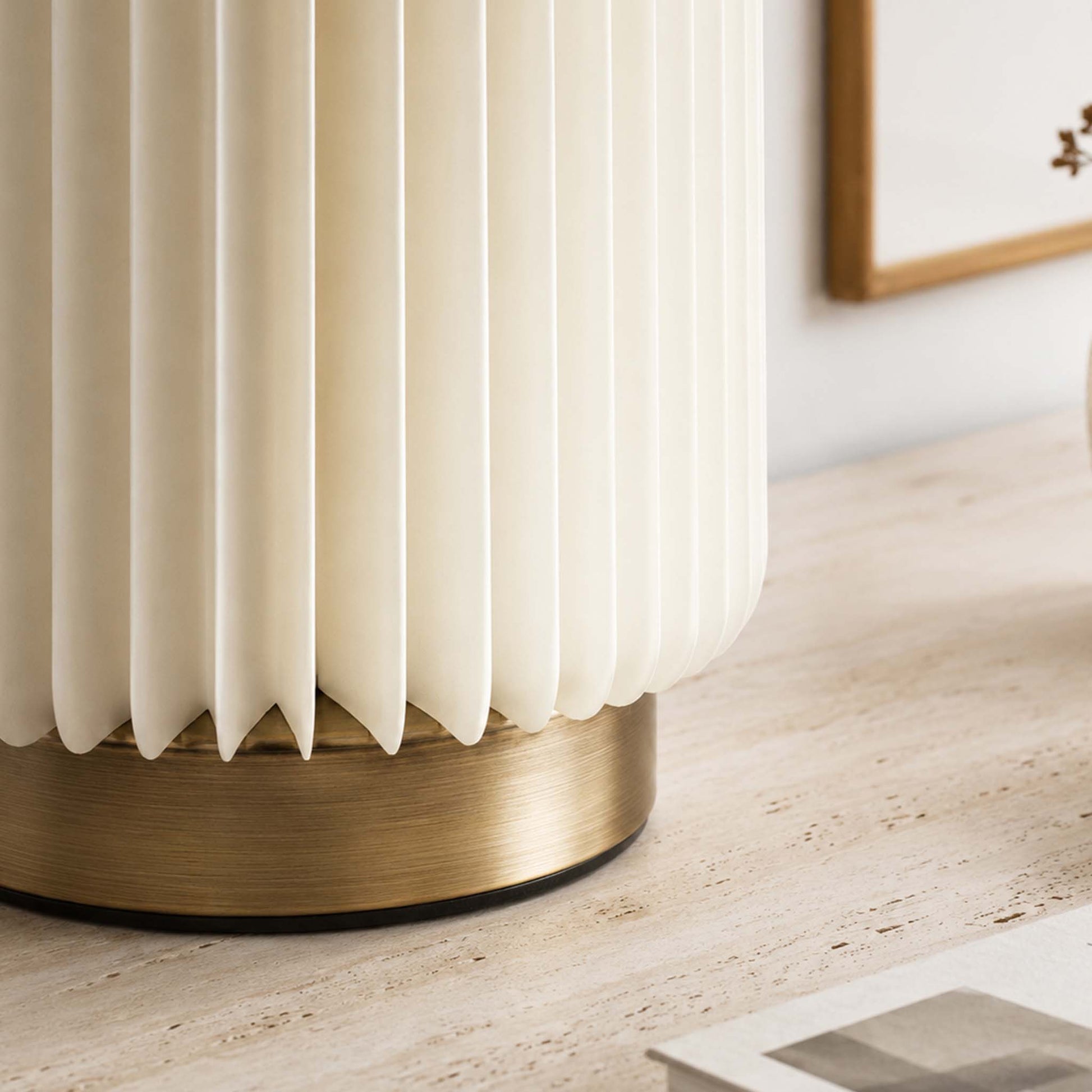 Close-up of the Bamboo Zen Desk Lamp with a white accordion paper shade and brushed metal base.