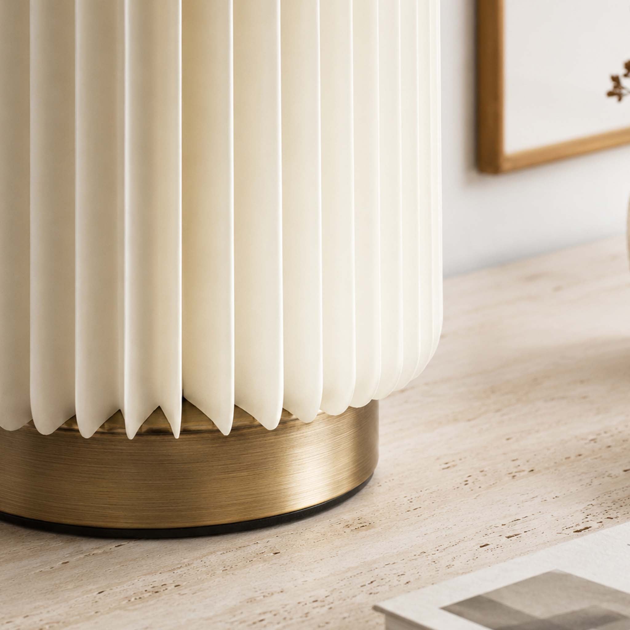 Close-up of the Bamboo Zen Desk Lamp with a white accordion paper shade and brushed metal base.