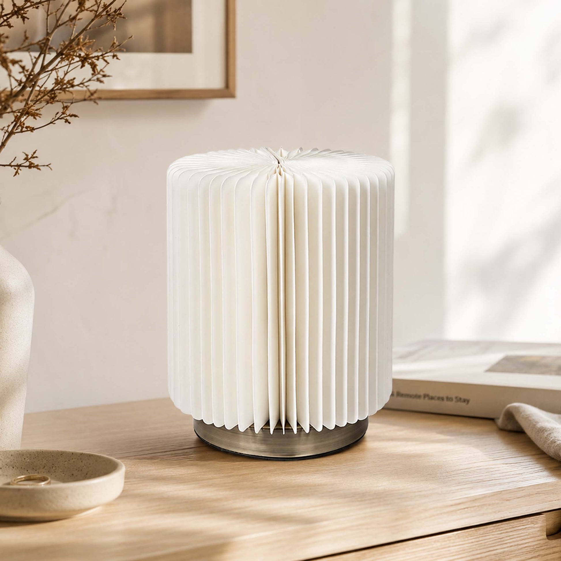 White Bamboo Zen accordion paper desk lamp on a modern wooden console with soft natural light.