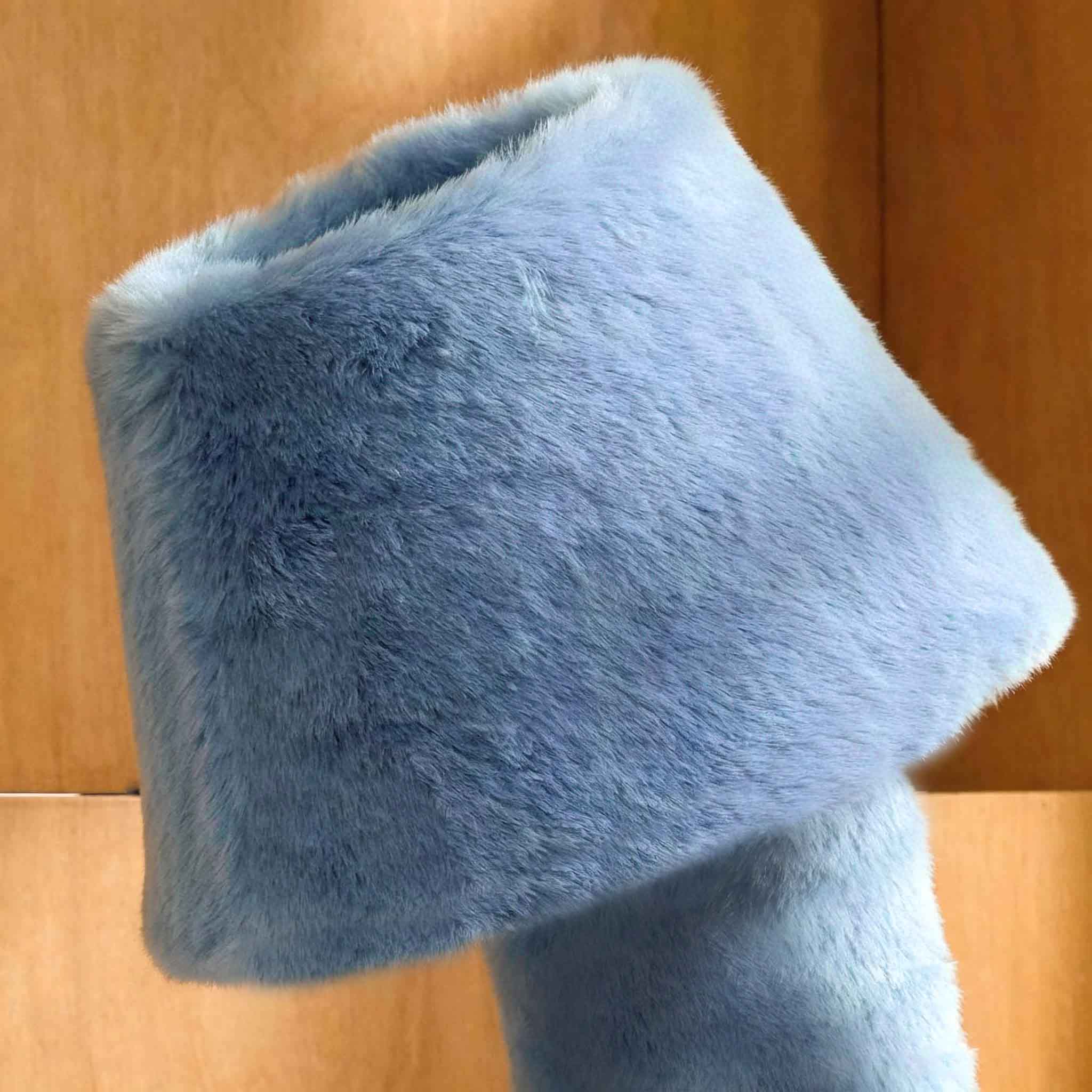 Close-up of the blue faux fur lamp shade showing its soft plush texture and sculptural rounded form.
