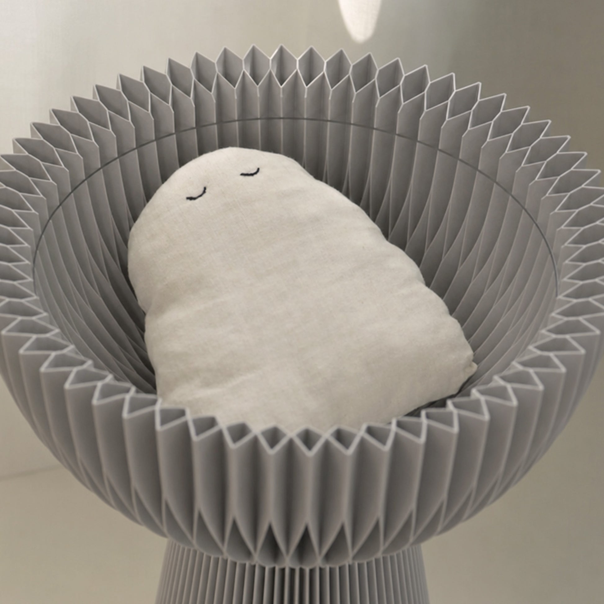 Close-up of the grey Bouquet Side Table A showing its center-hollow storage compartment.