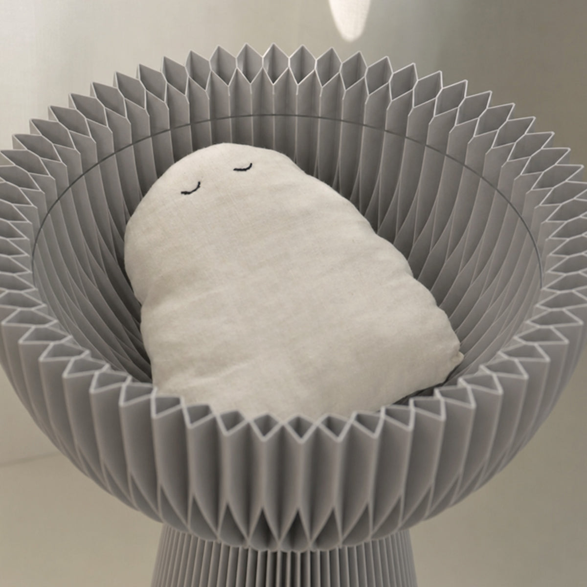 Close-up of the grey Bouquet Side Table A showing its center-hollow storage compartment.