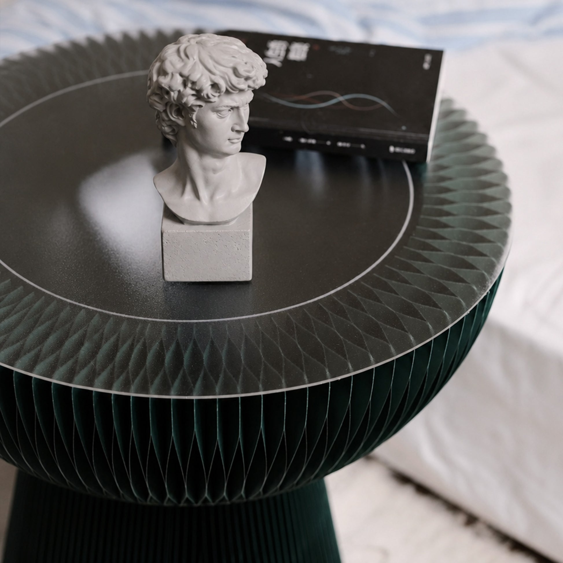 Pine green Bouquet Side Table A with acrylic tabletop styled with a classical bust and book.