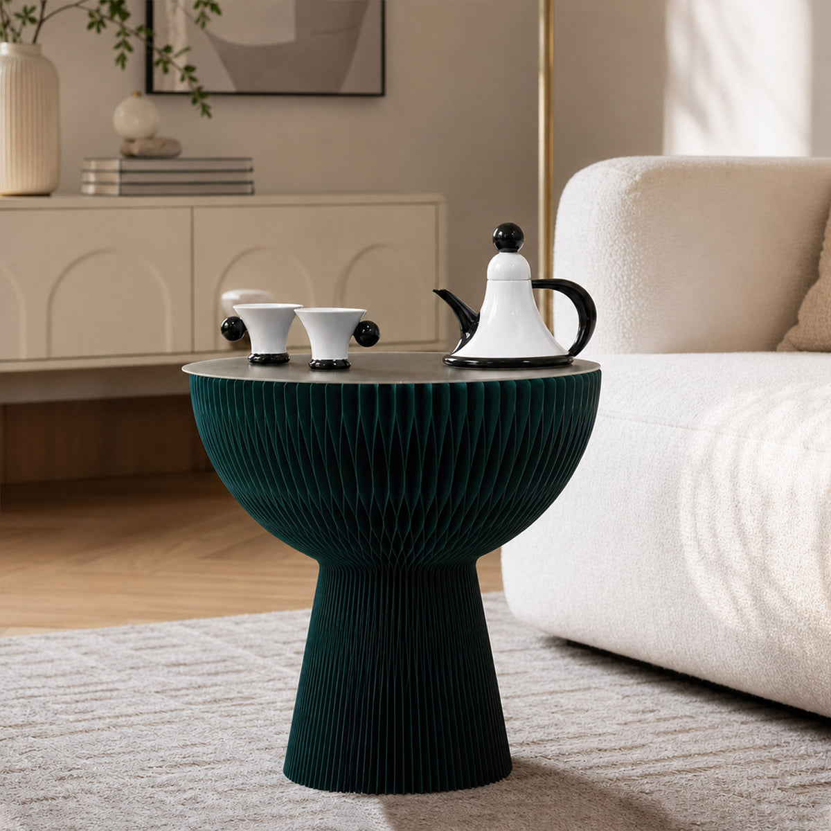 Pine green Bouquet Side Table A styled beside a sofa with a teapot and cups.
