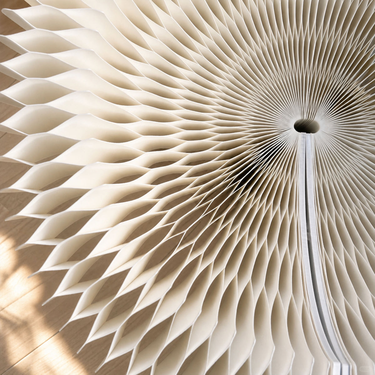 Close-up of the white Bouquet Side Table A radial honeycomb paper structure.