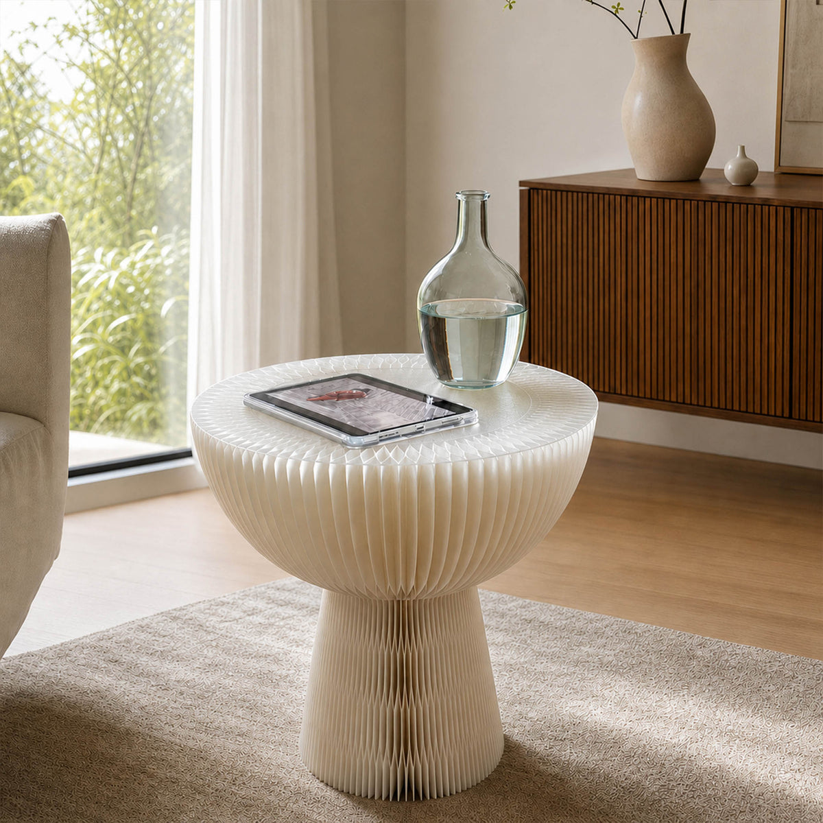 White Bouquet Side Table A with a tablet and glass carafe in a bright contemporary living room.