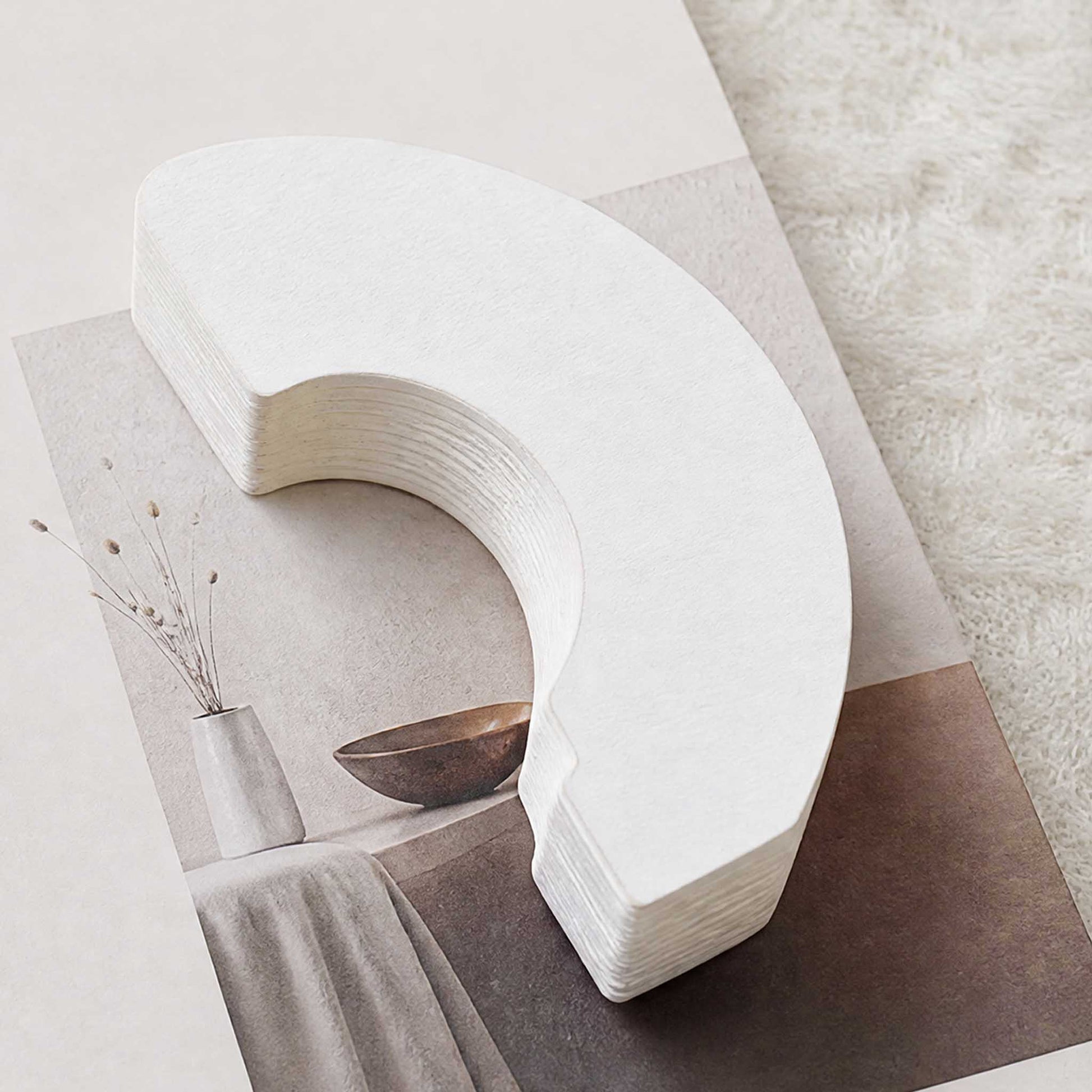 Close-up of the foldable white accordion paper lampshade for the Crescent Moon Desk Lamp.