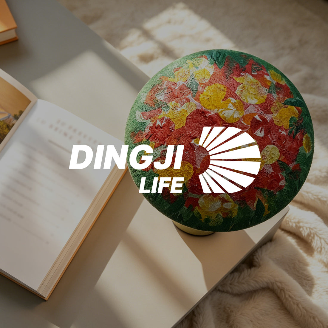 DINGJI LIFE brand banner with a colorful floral decorative light styled beside an open book in a soft home setting.