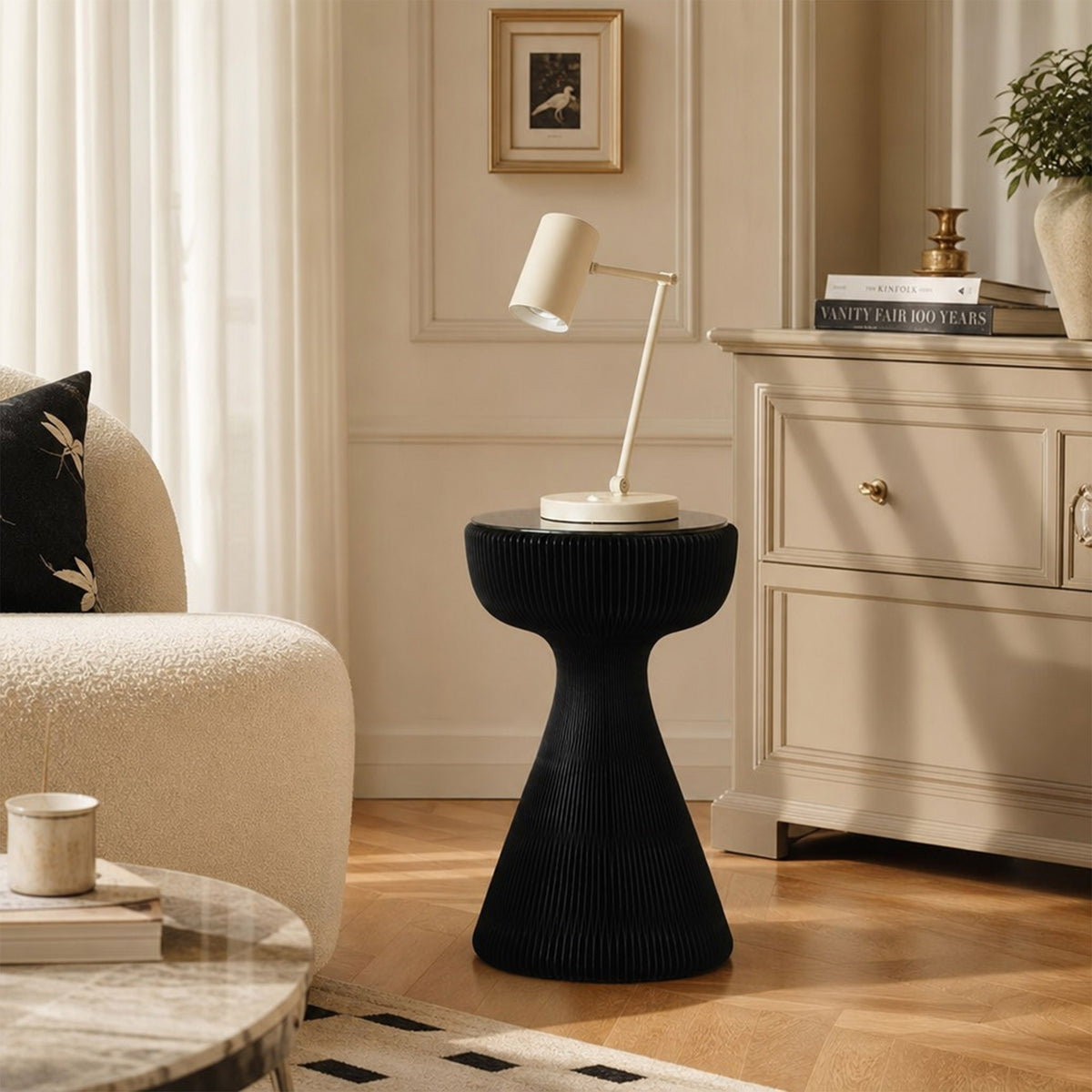 Black Little Black Dress Side Table with glass top and reading lamp in an elegant living room