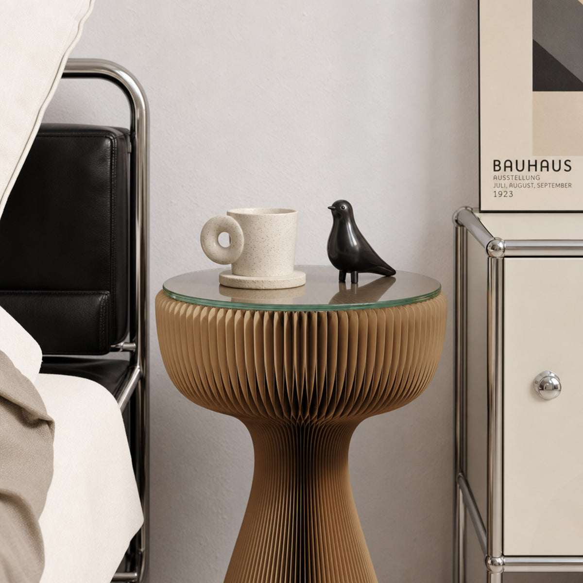 Brown Little Black Dress Side Table with glass top styled with a ceramic cup and black bird ornament in a Bauhaus-inspired interior