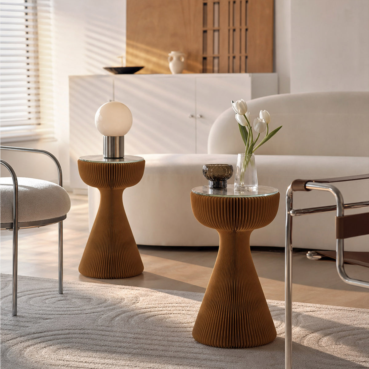 Pair of brown Little Black Dress Side Tables with glass tops styled with lighting and flowers in a modern living room