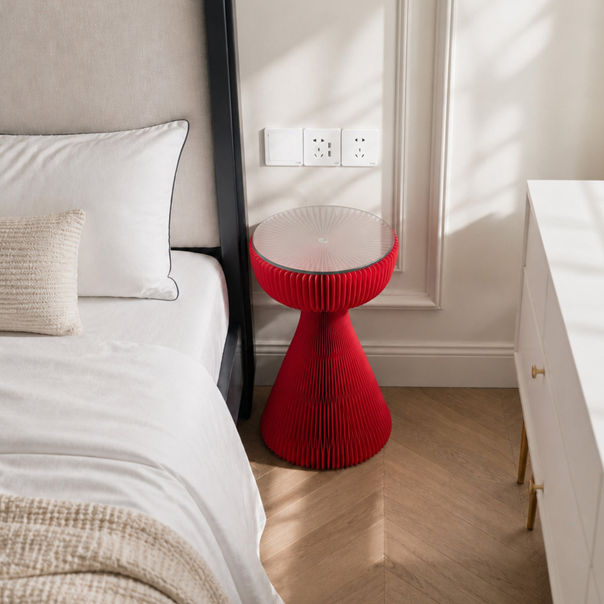 Red Little Black Dress Side Table used as a bedside table beside a modern upholstered bed