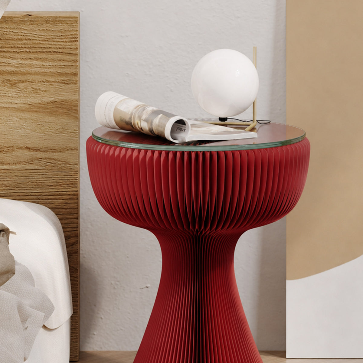 Red Little Black Dress Side Table with tempered glass top styled with a sculptural lamp and magazine