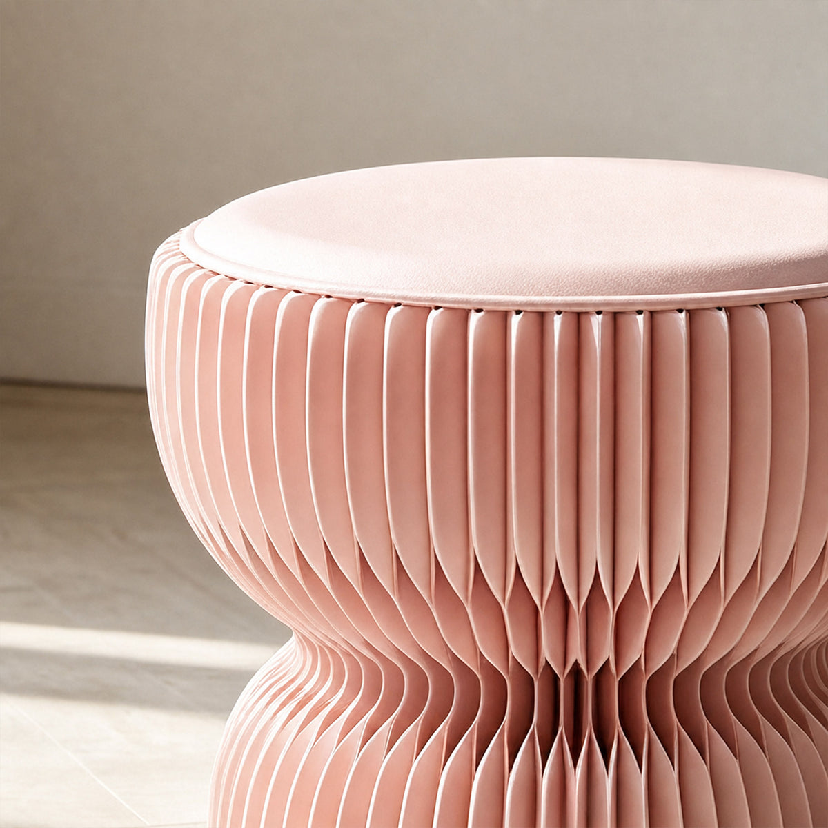 Close-up of the pink LOTUS Stool A with soft PU leather seat cushion and sculptural honeycomb paper body