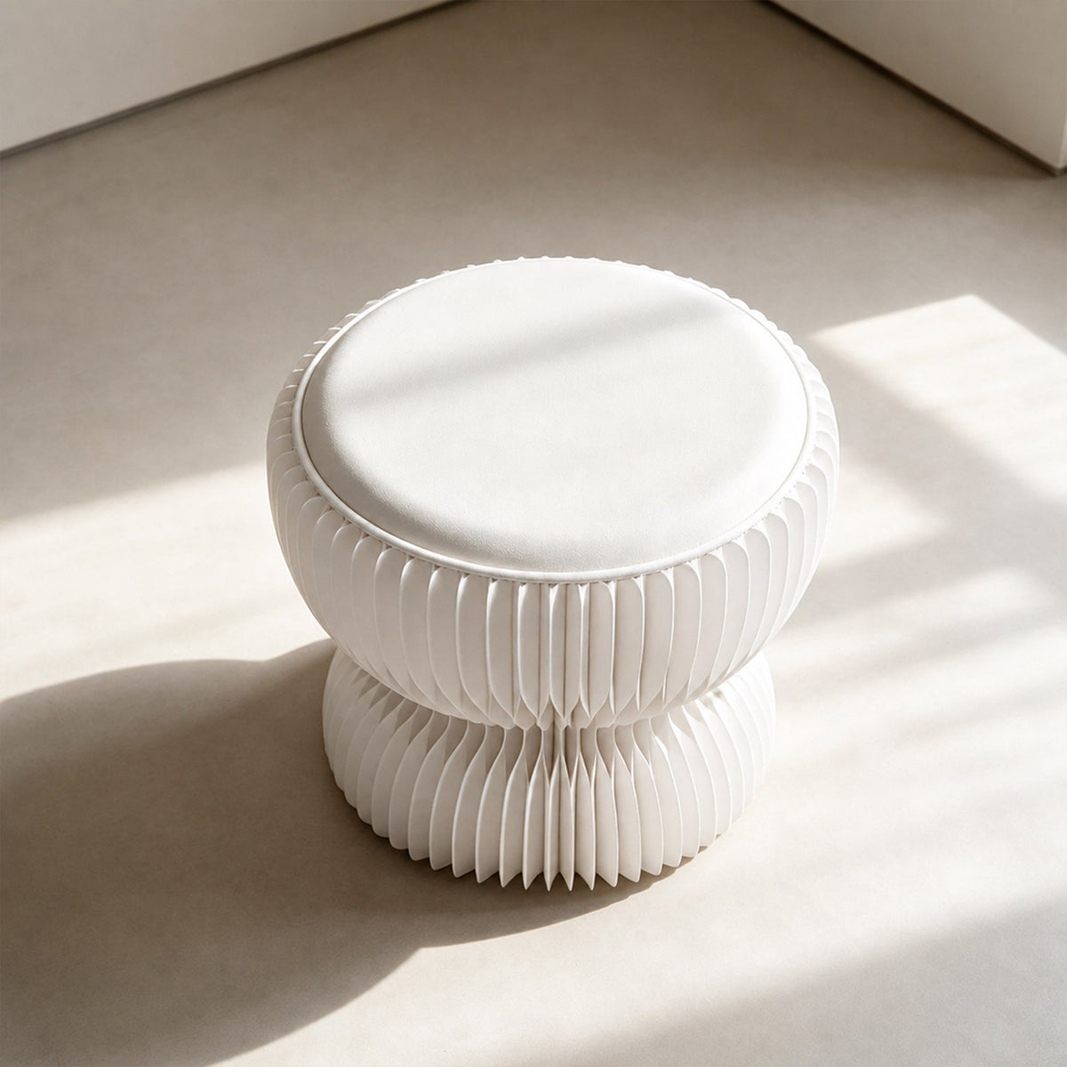 Angled top view of the white LOTUS Stool A showing its round PU leather cushion and sculptural honeycomb paper body