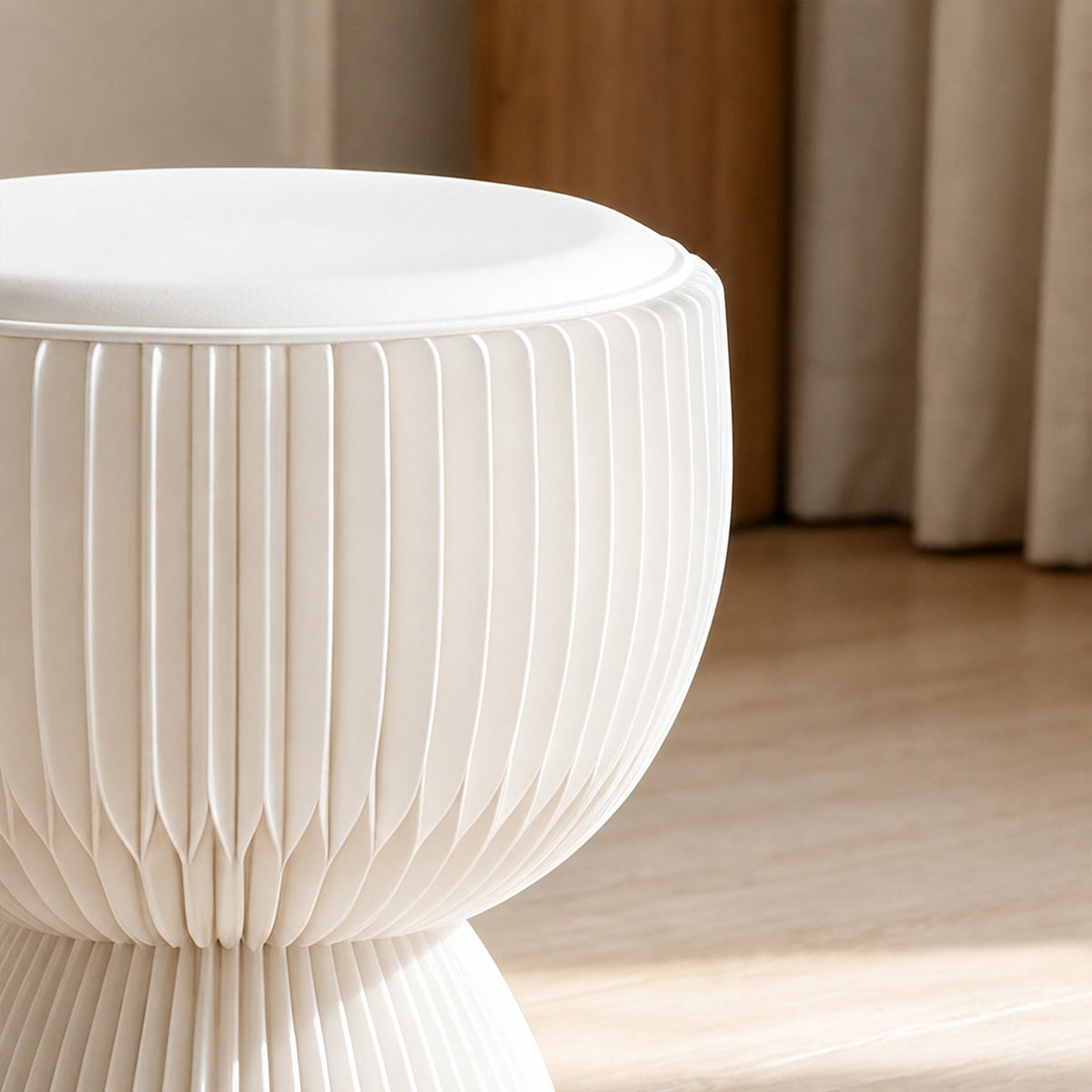 Detail of the white LOTUS Stool A with PU leather cushion and curved honeycomb paper construction