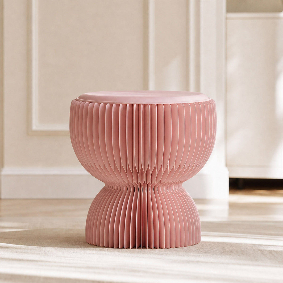 Front view of the pink LOTUS Stool B, a compact sculptural stool with foldable honeycomb paper construction