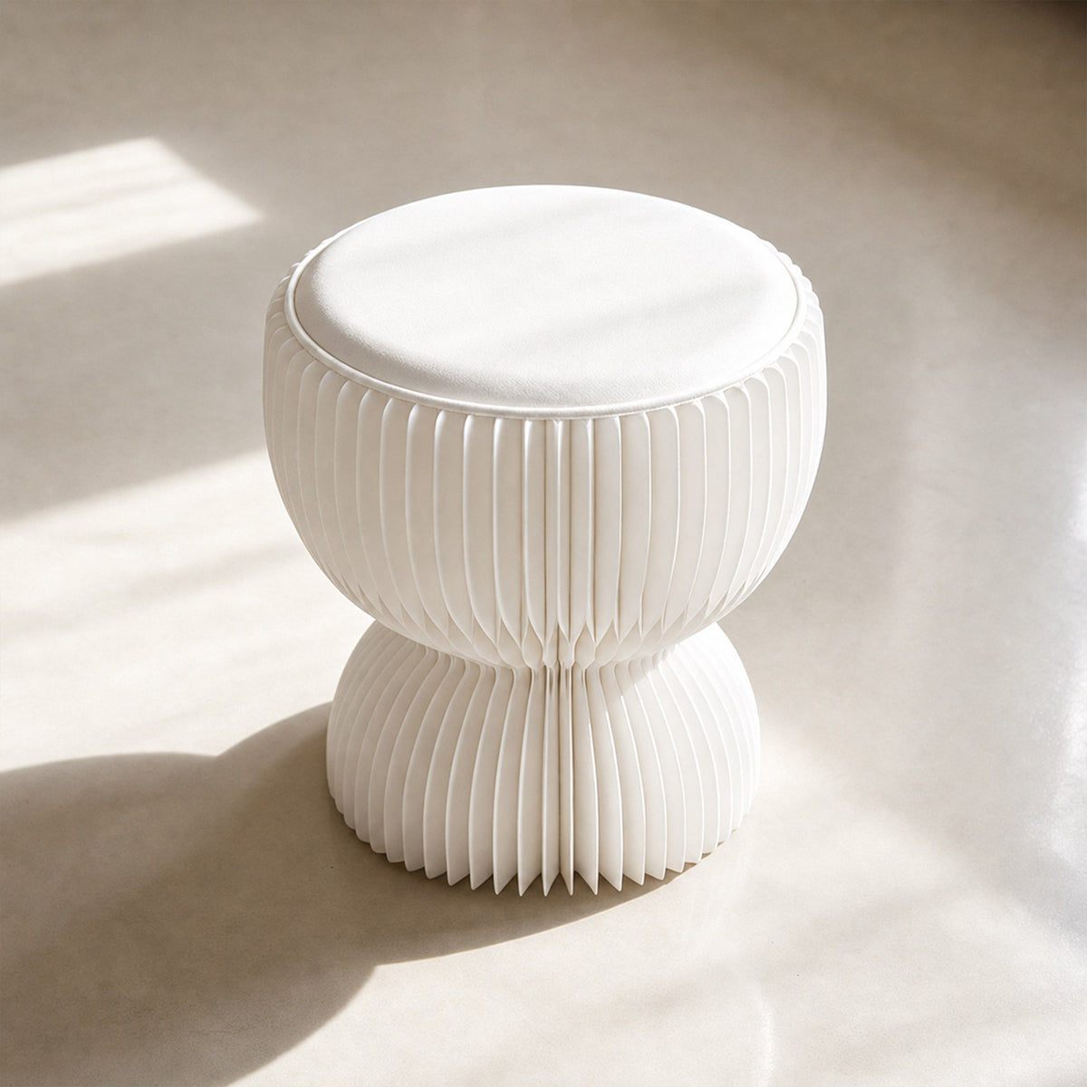 Angled top view of the white LOTUS Stool B showing its round PU leather cushion and sculptural paper form